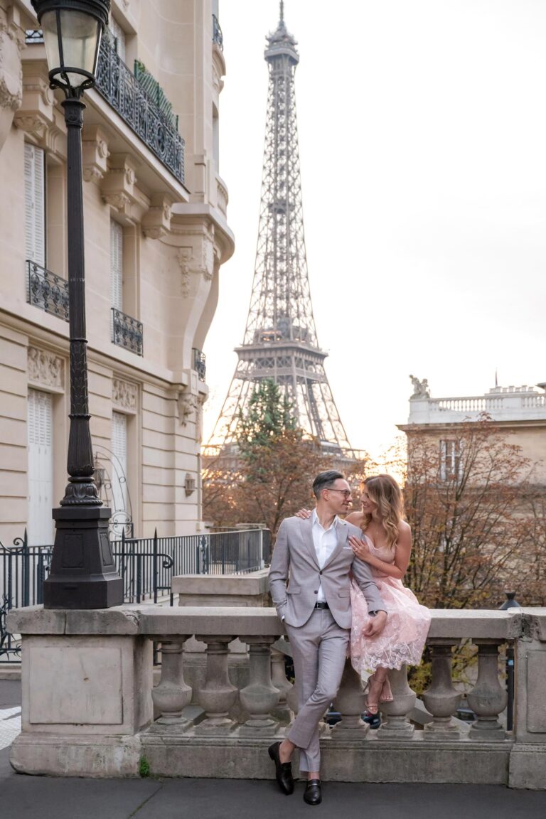 Couple looking at each other on Paris street near Eiffel Tower during morning photoshoot