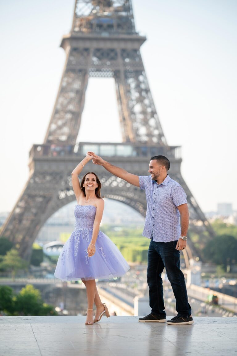 Happy couple dancing at Trocadéro with Eiffel Tower during Paris early morning photo session