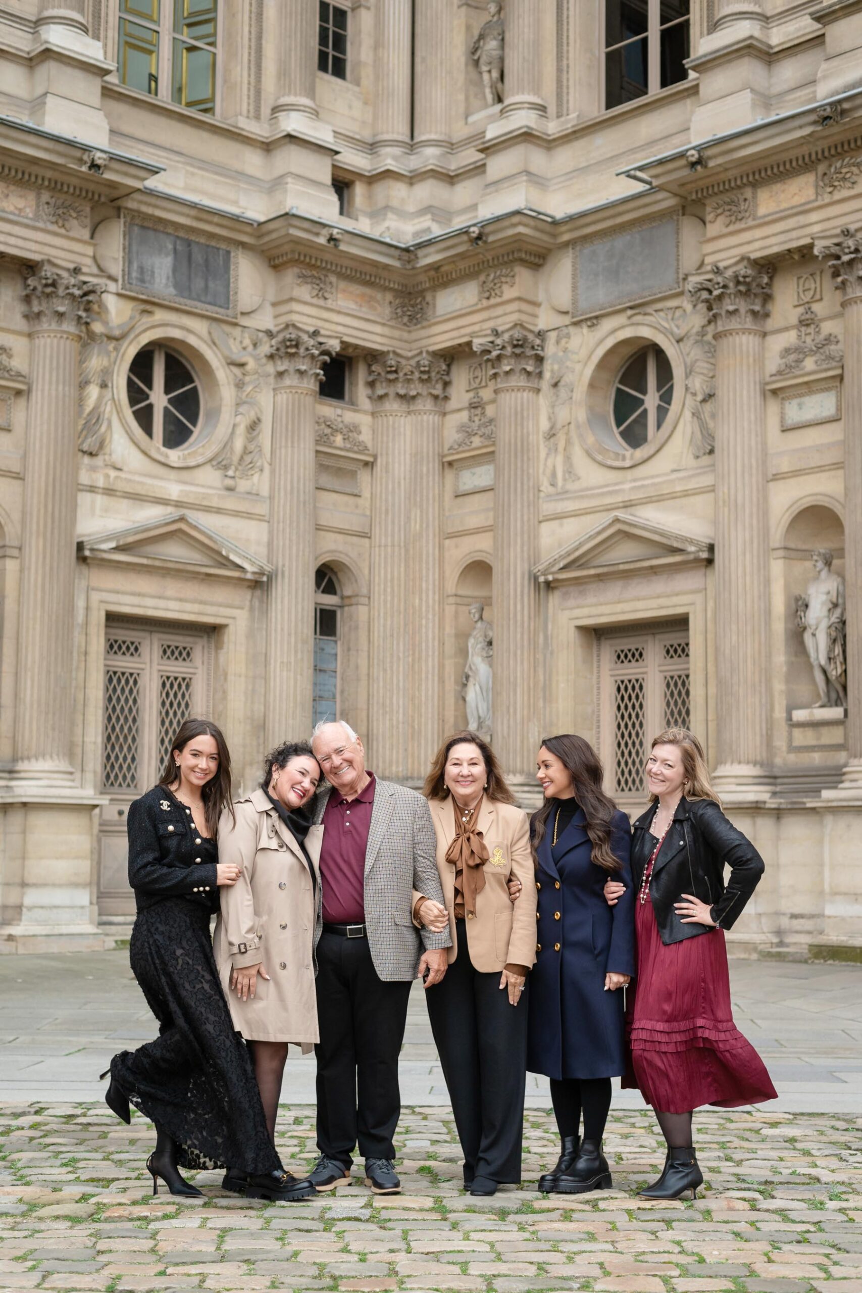 Family of six at the Louvre during winter Paris family photoshoot