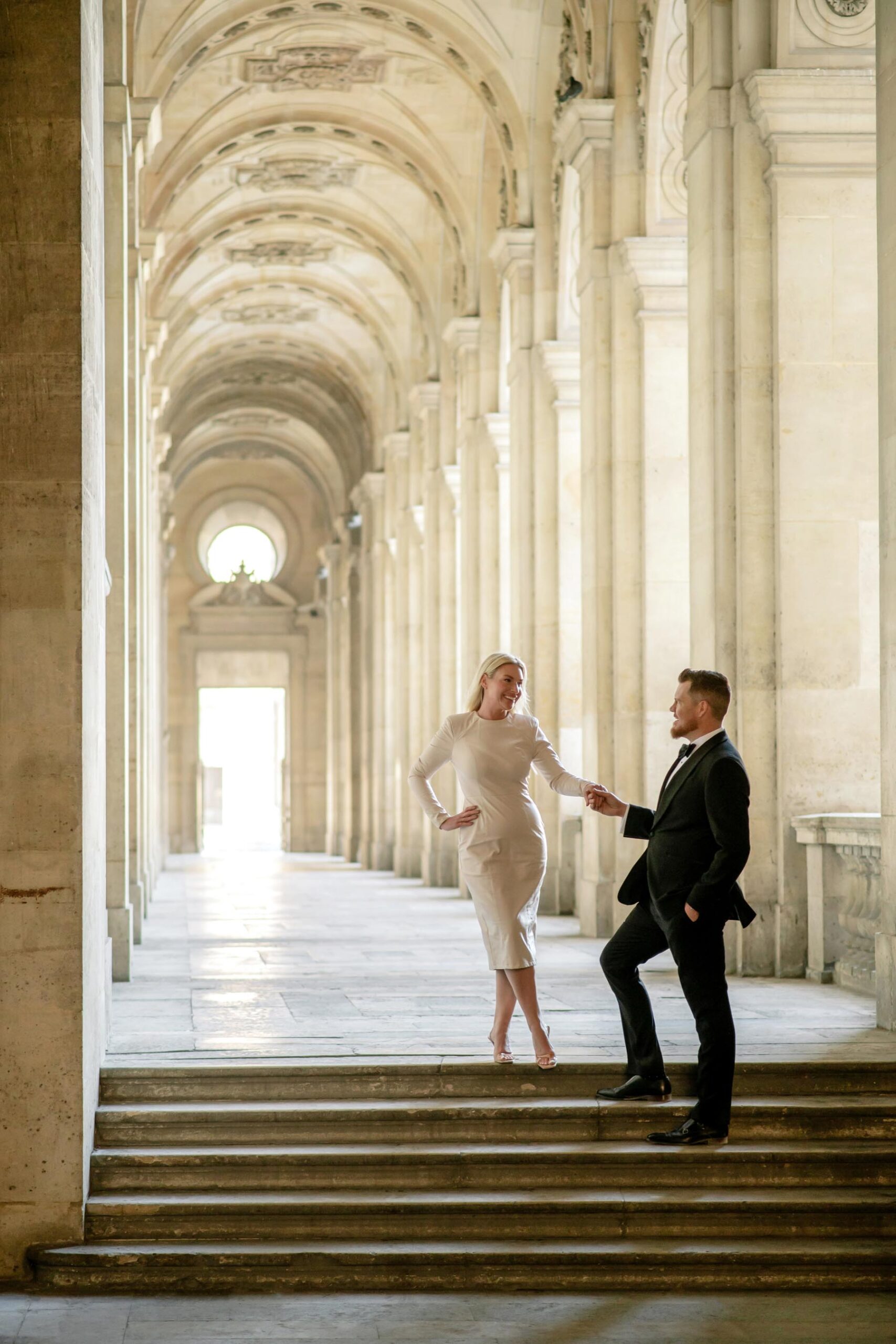 Editorial couple portrait at the Louvre during Paris couple photoshoot with fashion outfits