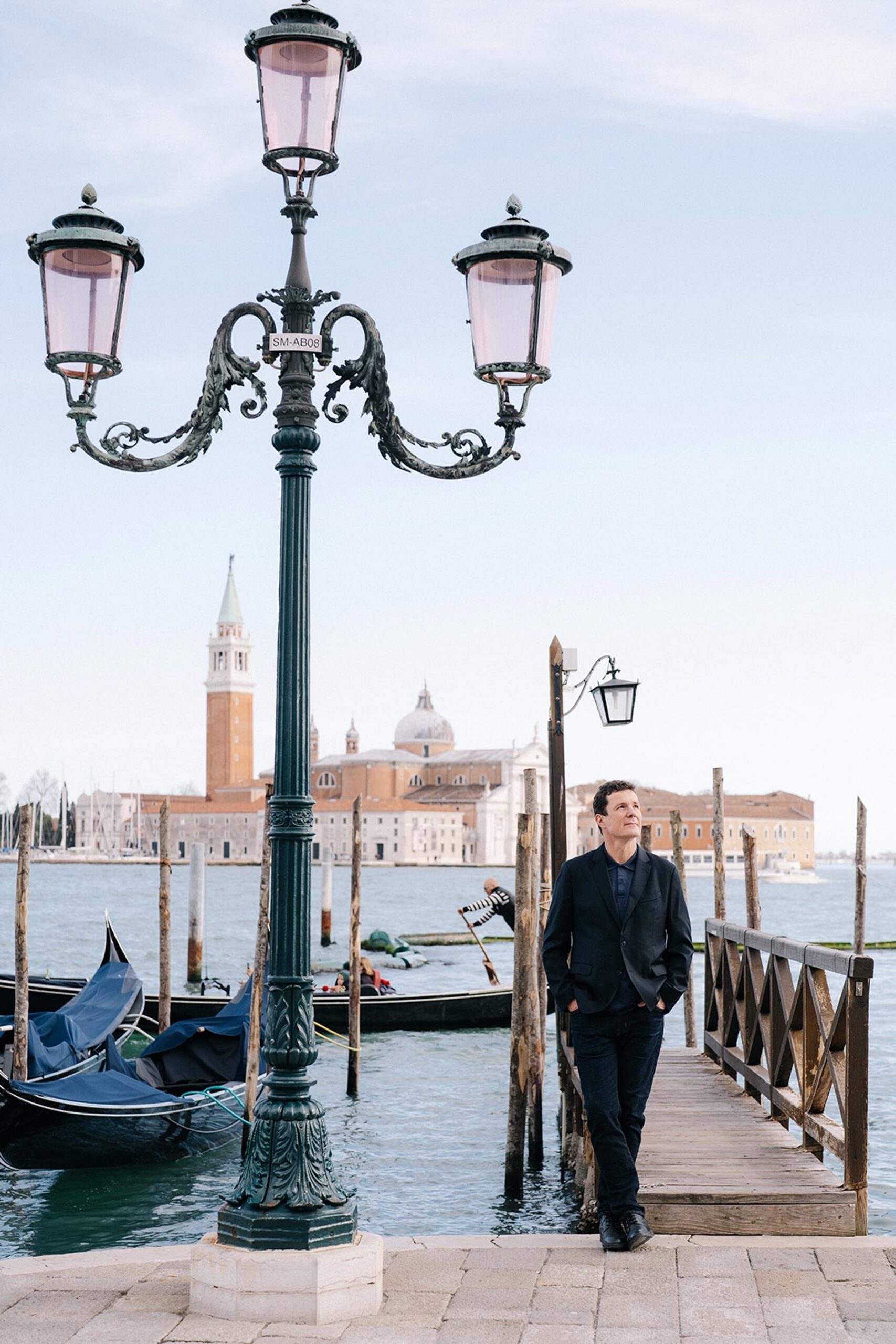 Portrait of Paris photographer Pierre Sattin in Venice Italy during travel