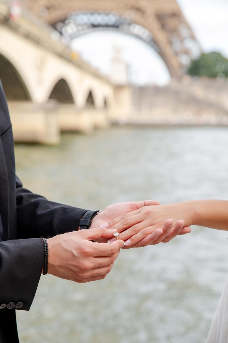 Close-up proposal ring moment near Eiffel Tower during Paris proposal photoshoot